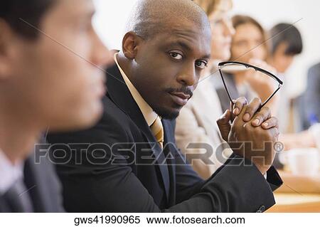 Business executives at a meeting in a board room View Large Photo Image Stock Photography - Business executives at a meeting in a board room. Fotosearch