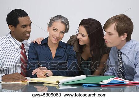 Business executives at a meeting in an office View Large Photo Image Stock Image - Business executives at a meeting in an office. Fotosearch
