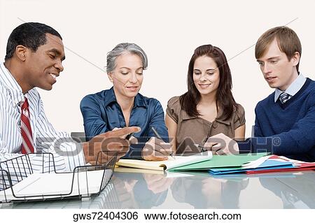 Business executives at a meeting in an office View Large Photo Image Stock Photograph - Business executives at a meeting in an office. Fotosearch