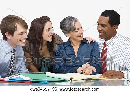 Business executives at a meeting in an office View Large Photo Image Stock Photograph - Business executives at a meeting in an office. Fotosearch