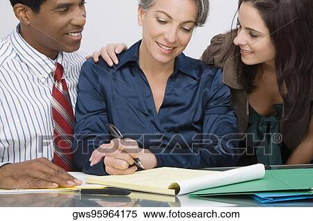 Business executives at a meeting in an office View Large Photo Image Stock Photography - Business executives at a meeting in an office. Fotosearch