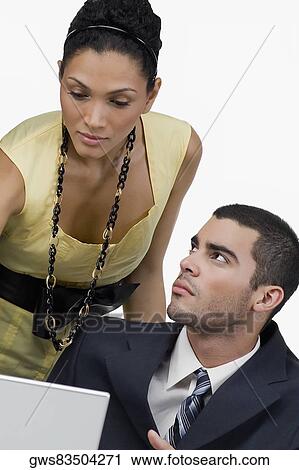 Business executives in front of a laptop View Large Photo Image Stock Image - Business executives in front of a laptop. Fotosearch