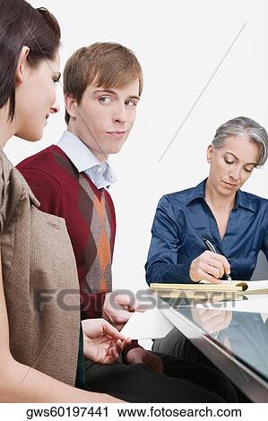 Businessman giving a love letter to a businesswoman View Large Photo Image Stock Image - Businessman giving a love letter to a businesswoman. Fotosearch