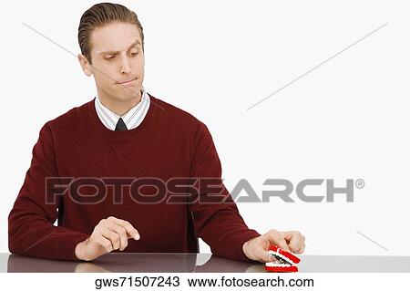 Businessman looking at dentures and thinking View Large Photo Image Stock Image - Businessman looking at dentures and thinking. Fotosearch