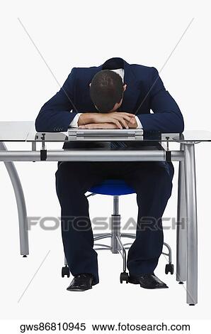 Businessman resting his head on a laptop View Large Photo Image Stock Photography - Businessman resting his head on a laptop. Fotosearch