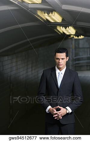 Businessman standing in a subway and thinking View Large Photo Image Stock Photo - Businessman standing in a subway and thinking. Fotosearch