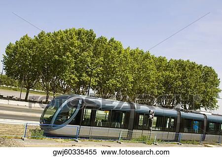Cable car on tracks with a river in the background, Garonne River, Bordeaux, France View Large Photo Image Stock Photography - Cable car on tracks with a river in the background, Garonne River, Bordeaux, France. Fotosearch
