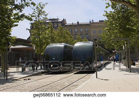 Stock Image - Cable cars on tracks, Quinconces Tram Station, Place des Quinconces, Bordeaux, France. Fotosearch