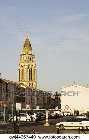 Stock Image - Car parked in a parking lot of a church, Leglise Sainte-Marie De La Bastide, Bordeaux, Aquitaine, France. Fotosearch