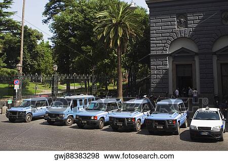 Cars parked in front of a building, Naples, Naples Province, Campania, Italy View Large Photo Image Stock Photo - Cars parked in front of a building, Naples, Naples Province, Campania, Italy. Fotosearch