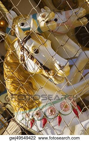 Chain-link fence in front of carousel horses, Bordeaux, Aquitaine, France View Large Photo Image Stock Image - Chain-link fence in front of carousel horses, Bordeaux, Aquitaine, France. Fotosearch