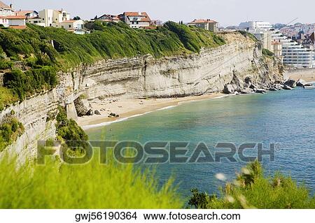Cliffs at a seaside, Baie De Biarritz, Biarritz, Pyrenees-Atlantiques, France View Large Photo Image Picture - Cliffs at a seaside, Baie De Biarritz, Biarritz, Pyrenees-Atlantiques, France. Fotosearch