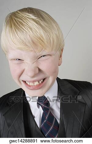 Close-up of a boy clenching his teeth View Large Photo Image Stock Image - Close-up of a boy clenching his teeth. Fotosearch