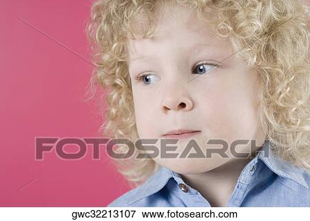 Stock Photo - Close-up of a boy looking angry. Fotosearch