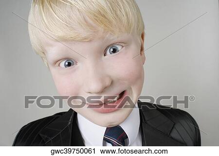 Close-up of a boy making a face View Large Photo Image Stock Image - Close-up of a boy making a face. Fotosearch