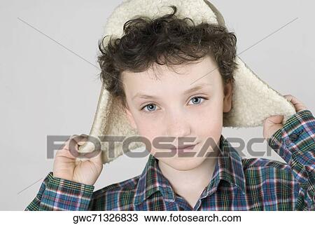 Close-up of a boy wearing a fur hat View Large Photo Image Stock Image - Close-up of a boy wearing a fur hat. Fotosearch