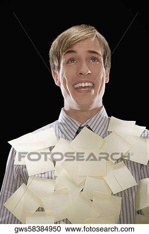 Close-up of a businessman covered with adhesive notes and smiling View Large Photo Image Stock Image - Close-up of a businessman covered with adhesive notes and smiling. Fotosearch