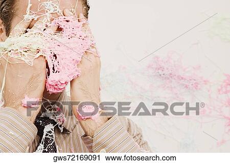 Close-up of a businessman covered with silly string View Large Photo Image Stock Image - Close-up of a businessman covered with silly string. Fotosearch