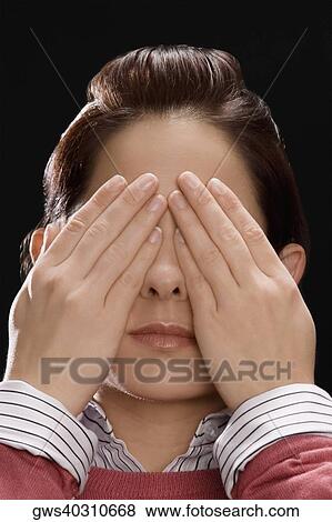 Close-up of a businesswoman covering her eyes with her hands View Large Photo Image Stock Photo - Close-up of a businesswoman covering her eyes with her hands . Fotosearch