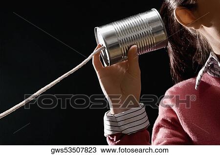 Close-up of a businesswoman using tin can phone View Large Photo Image Stock Image - Close-up of a businesswoman using tin can phone. Fotosearch