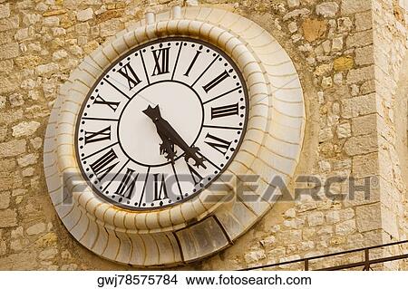 Close-up of a clock on a clock tower, Musee De La Castre, Cote d'Azur, Cannes, Provence-Alpes-Cote D'Azur, France View Large Photo Image Picture - Close-up of a clock on a clock tower, Musee De La Castre, Cote d'Azur, Cannes, Provence-Alpes-Cote D'Azur, France. Fotosearch