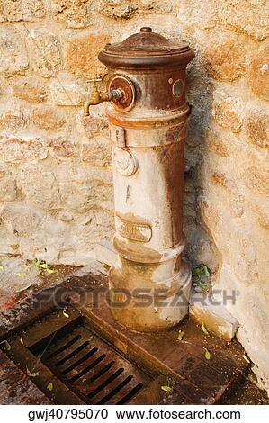 Close-up of a faucet, Siena Province, Tuscany, Italy View Large Photo Image Stock Image - Close-up of a faucet, Siena Province, Tuscany, Italy. Fotosearch