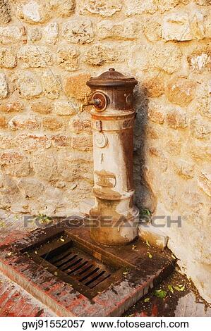 Close-up of a faucet, Siena Province, Tuscany, Italy View Large Photo Image Stock Photo - Close-up of a faucet, Siena Province, Tuscany, Italy. Fotosearch