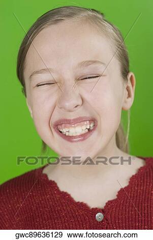 Close-up of a girl making a face View Large Photo Image Stock Photo - Close-up of a girl making a face. Fotosearch
