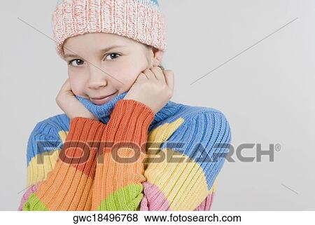 Stock Photo - Close-up of a girl wearing a knit hat. Fotosearch