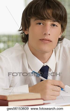 Close-up of a high school student writing in a notebook View Large Photo Image Stock Photo - Close-up of a high school student writing in a notebook. Fotosearch