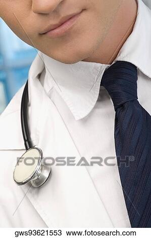 Close-up of a male doctor with a stethoscope around his neck View Large Photo Image Stock Image - Close-up of a male doctor with a stethoscope around his neck. Fotosearch