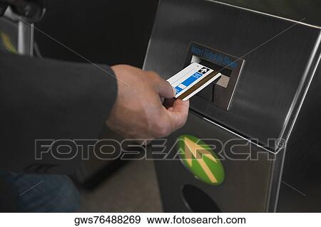 Close-up of a man's hand checking his ticket into a check-in machine View Large Photo Image Stock Photo - Close-up of a man's hand checking his ticket into a check-in machine. Fotosearch