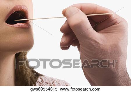 Close-up of a mature woman having a throat examination View Large Photo Image Stock Photography - Close-up of a mature woman having a throat examination. Fotosearch