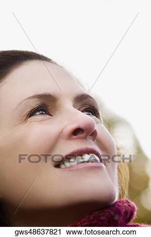 Close-up of a mature woman smiling View Large Photo Image Stock Image - Close-up of a mature woman smiling. Fotosearch