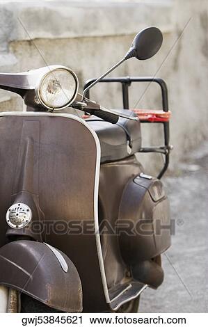 Close-up of a motor scooter, Italian Riviera, Santa Margherita Ligure, Genoa, Liguria, Italy View Large Photo Image Stock Image - Close-up of a motor scooter, Italian Riviera, Santa Margherita Ligure, Genoa, Liguria, Italy. Fotosearch
