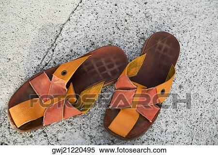 Stock Photography - Close-up of a pair of sandals, Italian Riviera, Genoa, Liguria, Italy. Fotosearch