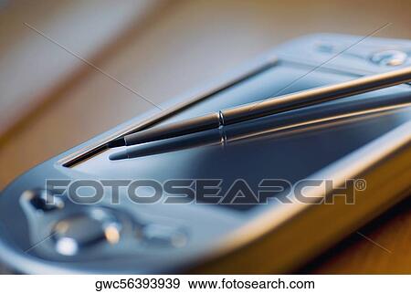 Close-up of a personal data assistant and a stylus View Large Photo Image Stock Photo - Close-up of a personal data assistant and a stylus. Fotosearch