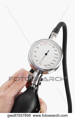 Close-up of a person's hand holding a blood pressure gauge View Large Photo Image Stock Photo - Close-up of a person's hand holding a blood pressure gauge. Fotosearch