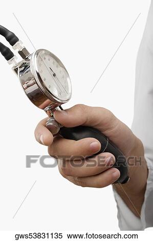 Close-up of a person's hand holding a blood pressure gauge View Large Photo Image Stock Photography - Close-up of a person's hand holding a blood pressure gauge. Fotosearch