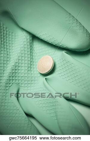 Close-up of a pill on a glove View Large Photo Image Stock Photography - Close-up of a pill on a glove. Fotosearch
