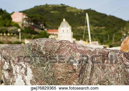 Close-up of a rock with a church in the background, Church of Santa Margherita d'Antiochia, Italian Riviera, Cinque Terre National Park, Vernazza, La Spezia, Liguria, Italy View Large Photo Image Stock Photography - Close-up of a rock with a church in the background, Church of Santa Margherita d'Antiochia, Italian Riviera, Cinque Terre National Park, Vernazza, La Spezia, Liguria, Italy. Fotosearch