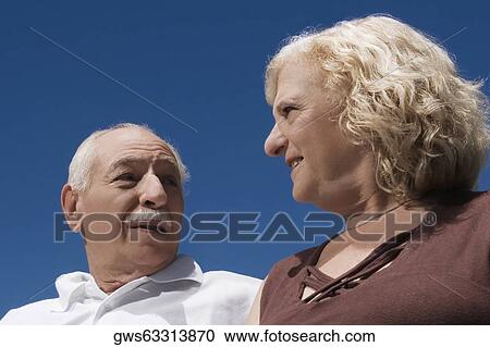 Stock Image - Close-up of a senior couple smiling. Fotosearch