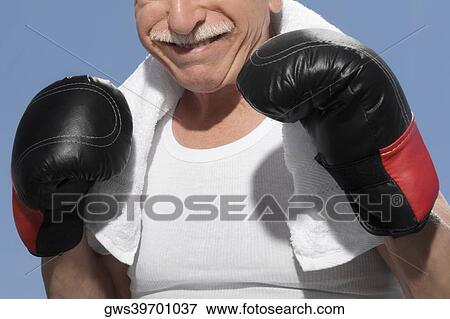 Stock Photo - Close-up of a senior man in boxing pose. Fotosearch