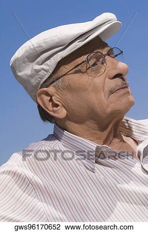 Stock Image - Close-up of a senior man thinking. Fotosearch