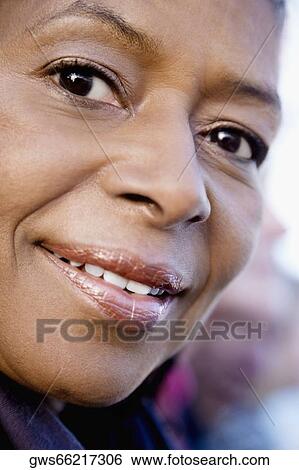 Close-up of a senior woman smiling View Large Photo Image Stock Photograph - Close-up of a senior woman smiling. Fotosearch