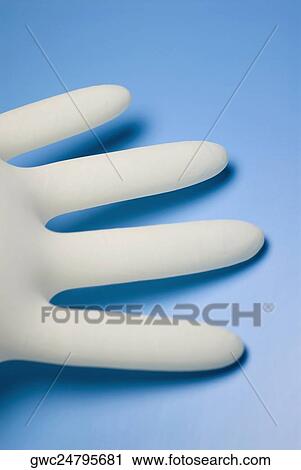 Stock Image - Close-up of a surgical glove. Fotosearch