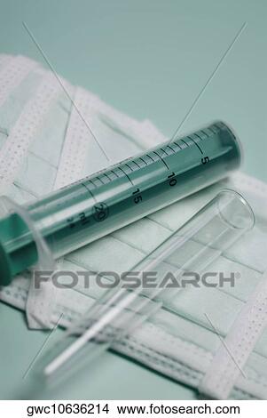 Close-up of a syringe and a test tube View Large Photo Image Picture - Close-up of a syringe and a test tube. Fotosearch