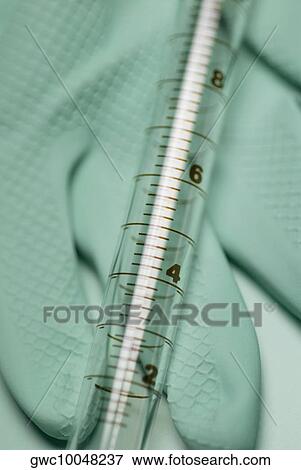 Close-up of a syringe on a glove View Large Photo Image Stock Photo - Close-up of a syringe on a glove. Fotosearch