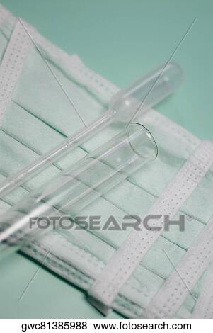 Close-up of a test tube and a pipette on a surgical mask View Large Photo Image Stock Photo - Close-up of a test tube and a pipette on a surgical mask. Fotosearch