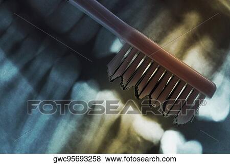 Close-up of a toothbrush on a dental X-Ray View Large Photo Image Stock Photo - Close-up of a toothbrush on a dental X-Ray. Fotosearch